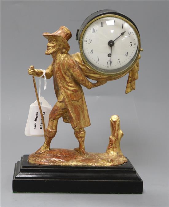 A 19th century French drum cased eight day mantel timepiece, supported by a figure of a man walking height 23.5cm